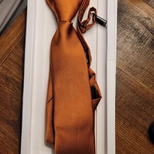 Child sized tie-rust colored